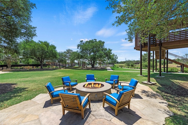 view of patio with stairway and an outdoor fire pit