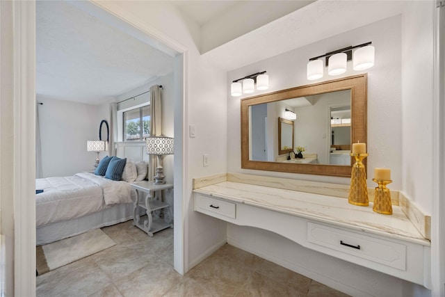bathroom featuring ensuite bath, vanity, and tile patterned floors