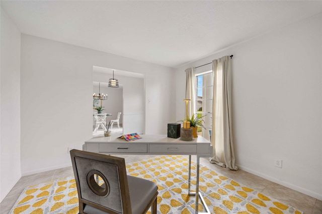home office featuring baseboards, a notable chandelier, and light tile patterned floors