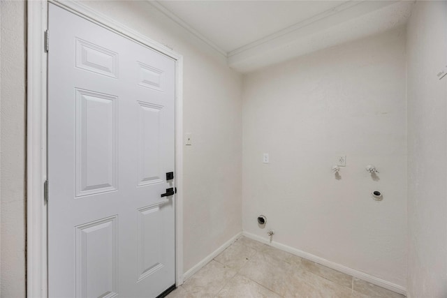 washroom with baseboards, gas dryer hookup, crown molding, and laundry area