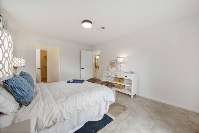 bedroom with visible vents and baseboards