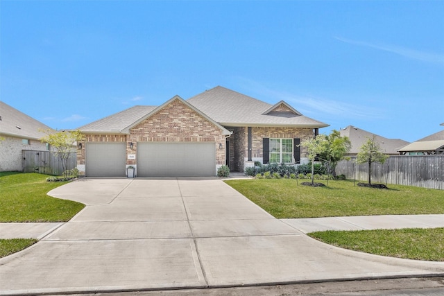 31411 Raleigh Creek Dr, Tomball, TX 77375 - view of front of property featuring a garage, brick siding, concrete driveway, and a shingled roof