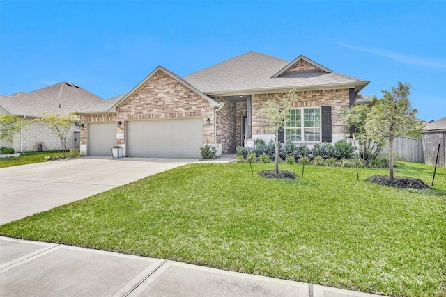 31411 Raleigh Creek Dr, Tomball, TX 77375 - view of front of house with an attached garage, driveway, brick siding, and roof with shingles