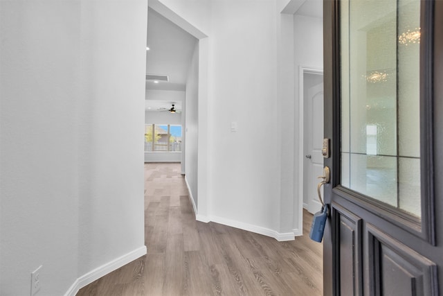 31411 Raleigh Creek Dr, Tomball, TX 77375 - foyer featuring baseboards, light wood-style flooring, and a ceiling fan