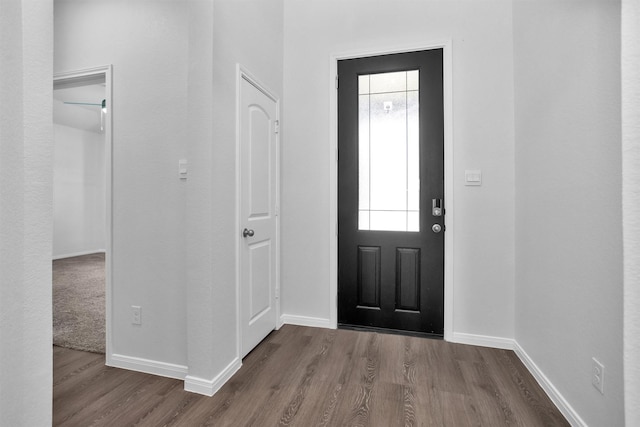 31411 Raleigh Creek Dr, Tomball, TX 77375 - foyer entrance featuring dark wood-style flooring and baseboards