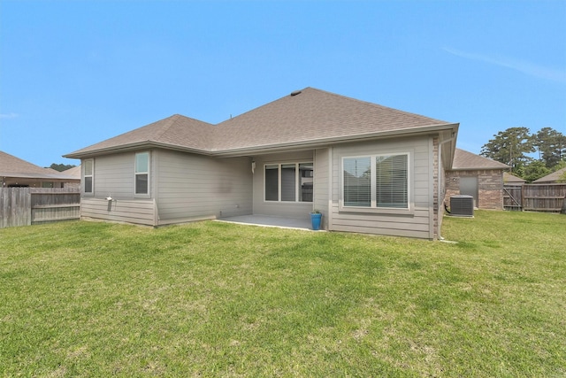 31411 Raleigh Creek Dr, Tomball, TX 77375 - rear view of house with a patio, central air condition unit, and a shingled roof