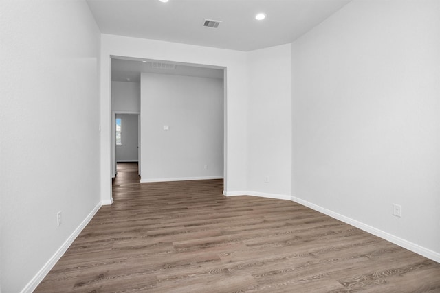 31411 Raleigh Creek Dr, Tomball, TX 77375 - empty room with wood finished floors, recessed lighting, and baseboards