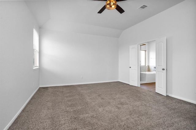 31411 Raleigh Creek Dr, Tomball, TX 77375 - unfurnished bedroom featuring carpet flooring, lofted ceiling, baseboards, connected bathroom, and ceiling fan