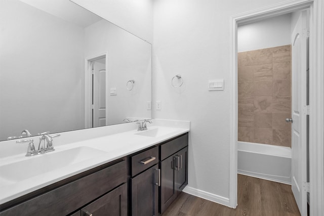 31411 Raleigh Creek Dr, Tomball, TX 77375 - full bath with wood finished floors, double vanity, baseboards, and shower / washtub combination