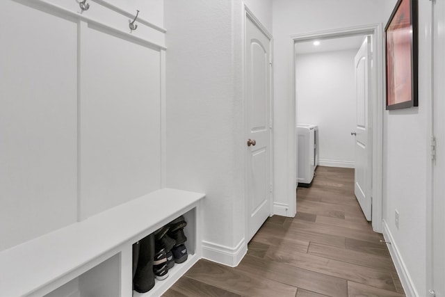 mudroom featuring baseboards, recessed lighting, washer / dryer, and wood finished floors