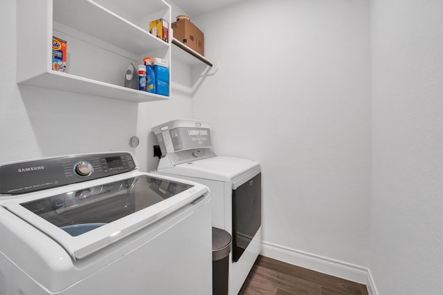 20131 Wild Horse Hollow Ln, Tomball, TX 77377 - laundry area with washing machine and clothes dryer, baseboards, and dark wood-style flooring