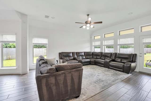 living area with wood tiled floor, visible vents, and a ceiling fan
