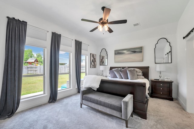 20131 Wild Horse Hollow Ln, Tomball, TX 77377 - bedroom featuring light carpet, multiple windows, a ceiling fan, and baseboards
