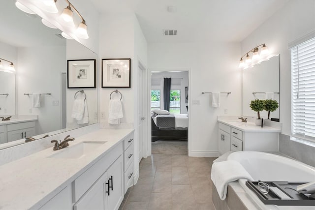 bathroom with two vanities, visible vents, and a sink