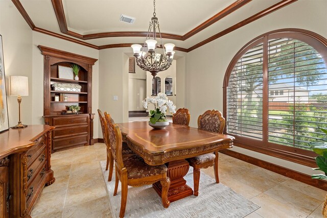 dining room with crown molding, arched walkways, a notable chandelier, and visible vents