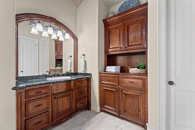 bathroom featuring vanity and baseboards