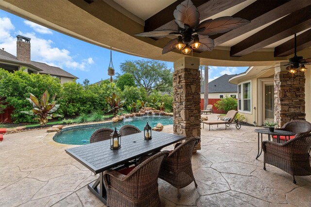view of patio / terrace featuring a ceiling fan, outdoor dining space, and an outdoor pool