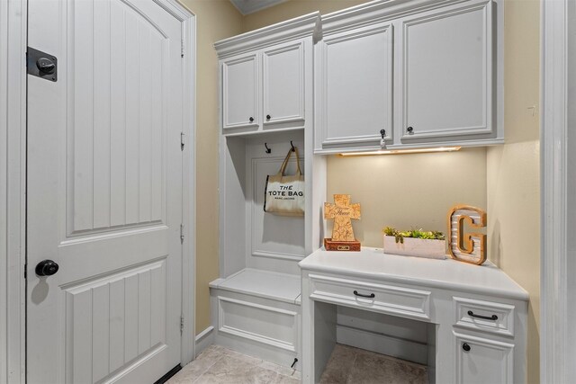 mudroom with light tile patterned floors