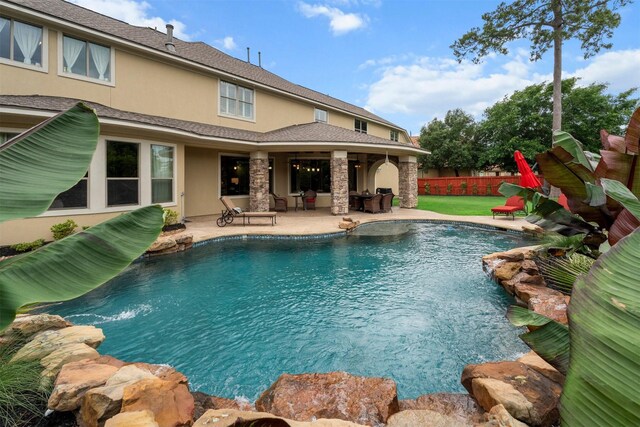view of pool featuring a patio, fence, and a fenced in pool