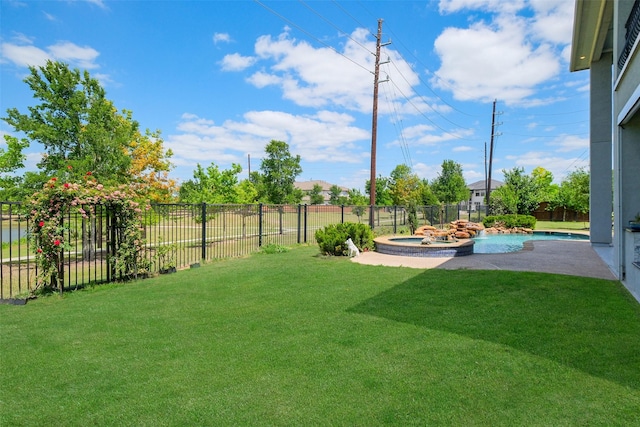 view of yard with a fenced backyard and a pool with connected hot tub