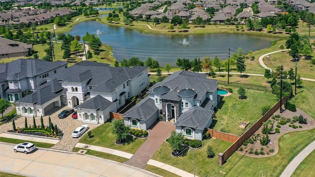 aerial view with a water view and a residential view
