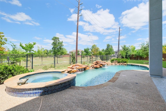 view of swimming pool with a fenced backyard, a patio area, and a pool with connected hot tub