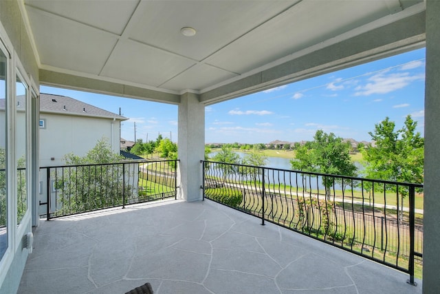 balcony featuring a water view