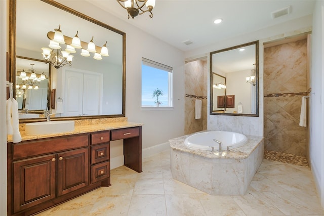 full bathroom with visible vents, vanity, baseboards, a chandelier, and a garden tub