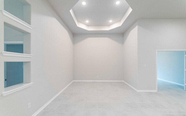 331 Riesling Dr, Alvin, TX 77511 - empty room with a raised ceiling, recessed lighting, and baseboards