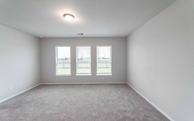 331 Riesling Dr, Alvin, TX 77511 - carpeted spare room with baseboards