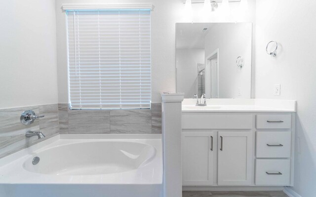 331 Riesling Dr, Alvin, TX 77511 - full bathroom with a garden tub and vanity