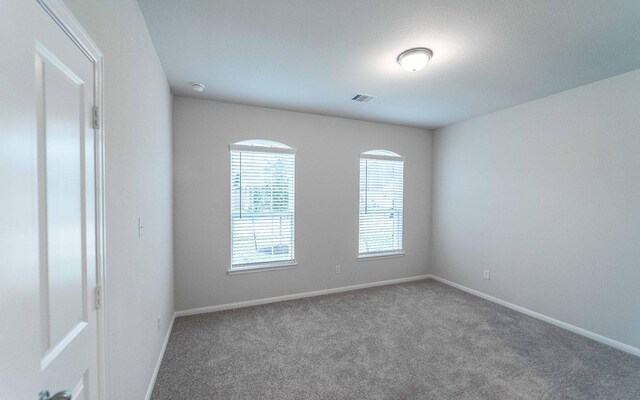 331 Riesling Dr, Alvin, TX 77511 - empty room featuring carpet floors, baseboards, and a smoke detector