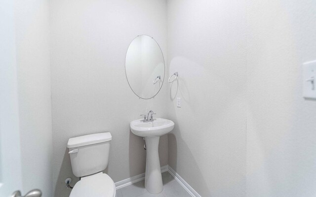 331 Riesling Dr, Alvin, TX 77511 - bathroom with toilet and tile patterned floors