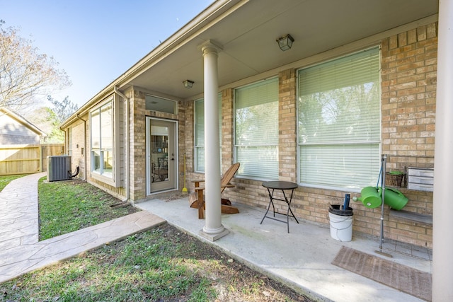 view of patio / terrace with fence and central AC unit