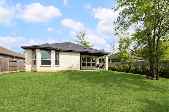 209 W Stargazer Lily Bnd, Montgomery, TX 77316 - rear view of house featuring a patio area, brick siding, and roof with shingles