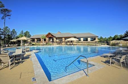 209 W Stargazer Lily Bnd, Montgomery, TX 77316 - community pool featuring a patio area