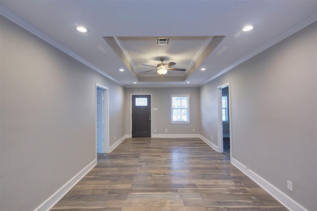 4220 Delhi St, Houston, TX 77022 - entrance foyer with a raised ceiling, visible vents, a ceiling fan, dark wood-type flooring, and ornamental molding