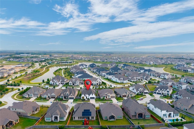 birds eye view of property featuring a residential view and a water view