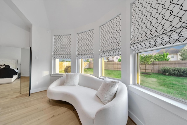 sitting room featuring baseboards and wood finished floors