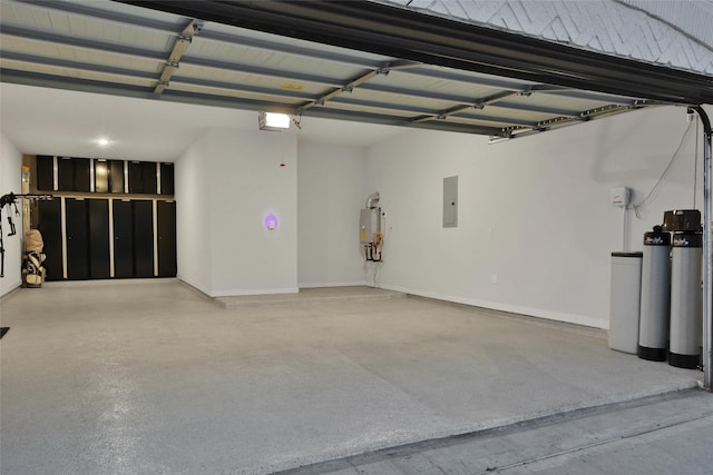 garage featuring a garage door opener, water heater, and electric panel