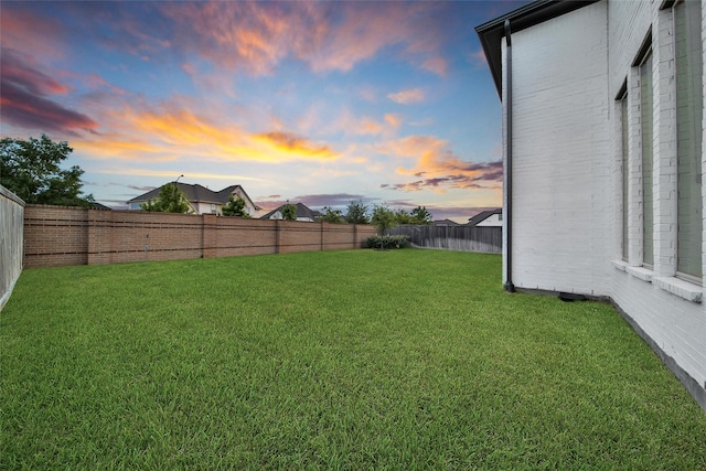 view of yard with a fenced backyard