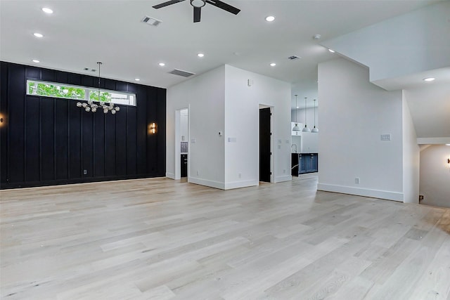 1907 Lauderdale St, Houston, TX 77030 - unfurnished living room featuring light wood-type flooring, visible vents, and ceiling fan with notable chandelier