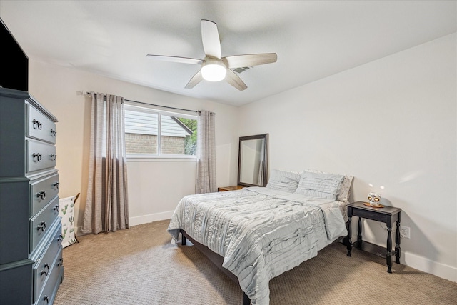bedroom with light carpet, a ceiling fan, visible vents, and baseboards