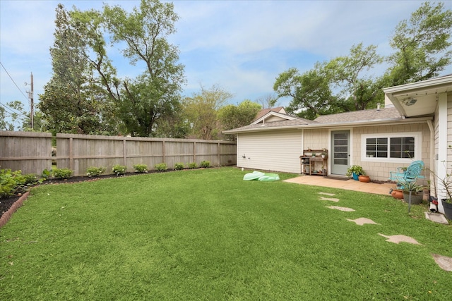 view of yard with a patio and a fenced backyard