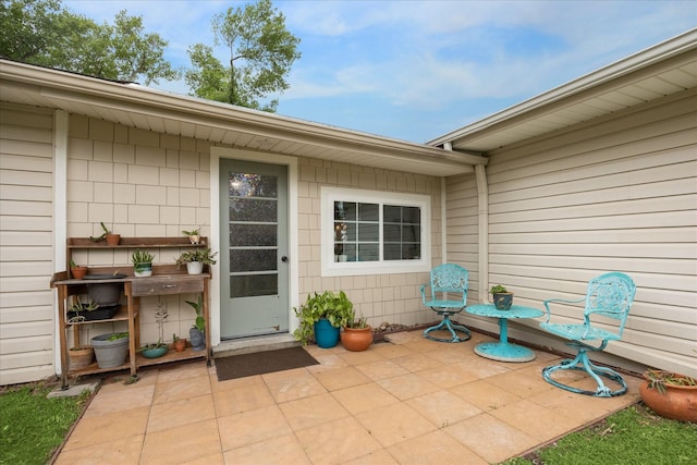 property entrance featuring a patio