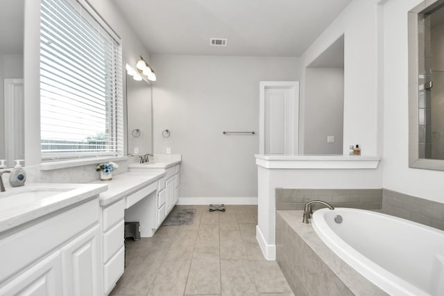 full bath with a bath, visible vents, a sink, and double vanity