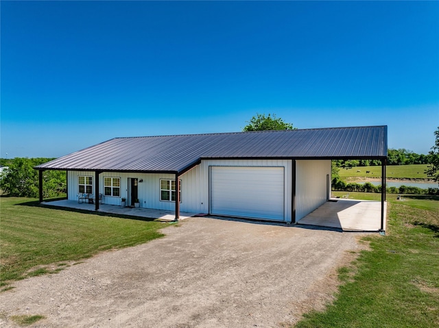 108 High Meadow Ct, Schulenburg, TX 78956 - view of front of home with a porch, metal roof, dirt driveway, and a front yard