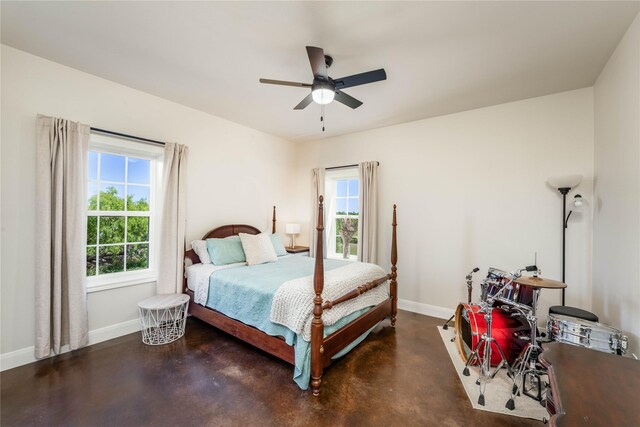 108 High Meadow Ct, Schulenburg, TX 78956 - bedroom with ceiling fan, baseboards, and finished concrete floors