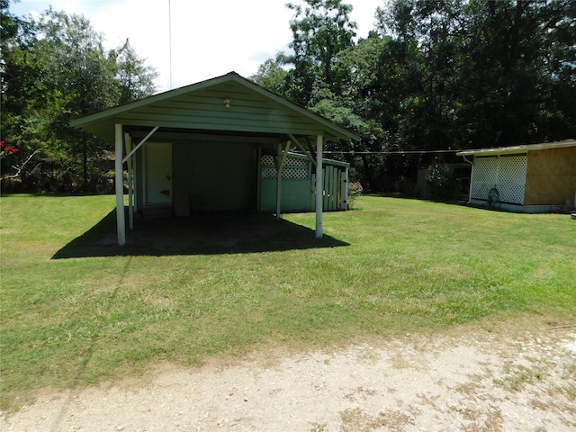 view of outbuilding with a detached carport