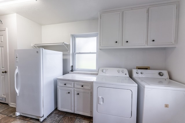 laundry area with washer and dryer and cabinet space